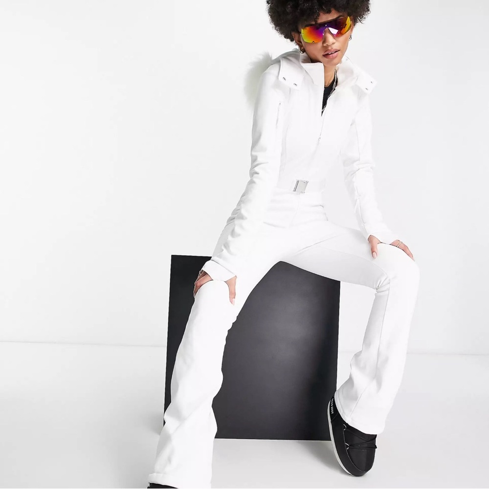 ASOS 4505 Tall belted ski suit with slim kick leg and faux fur hood